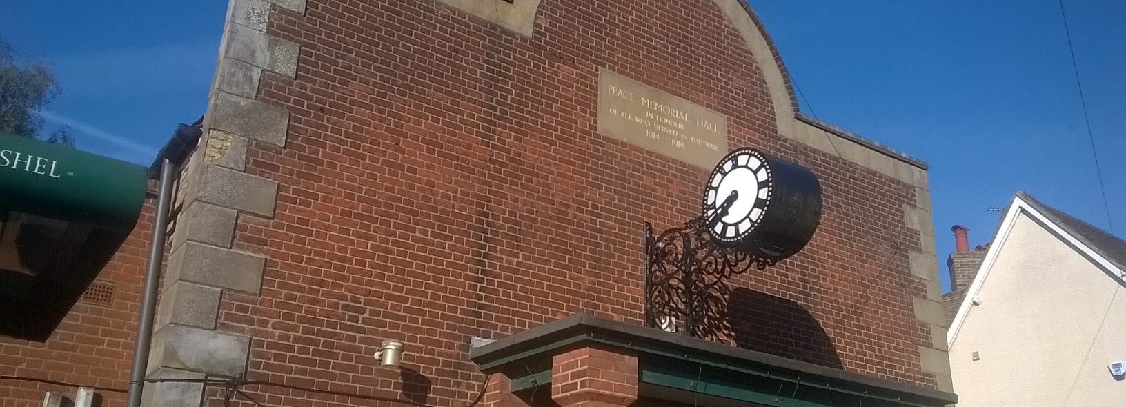 The facade of Codicote Peace Memorial Hall showing the clock